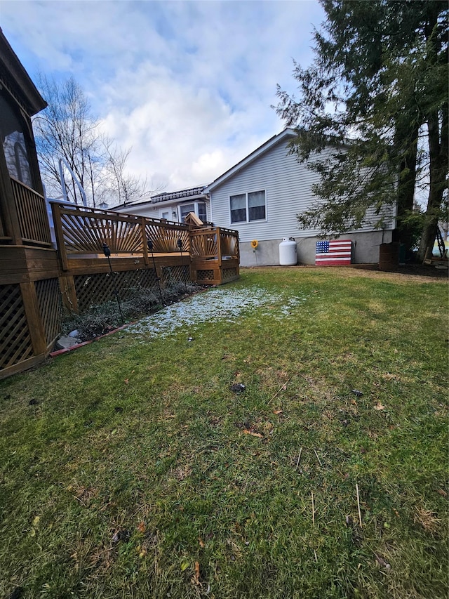 view of yard with a wooden deck