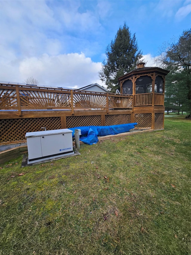 view of yard featuring a gazebo and a deck