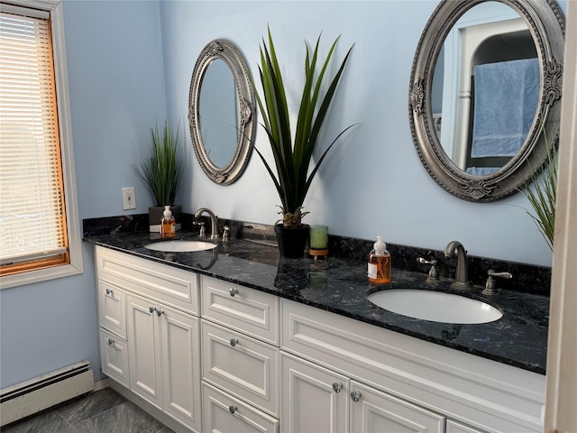 bathroom featuring vanity and baseboard heating