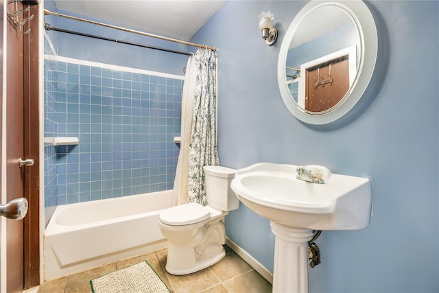 bathroom featuring toilet, tile patterned flooring, and shower / bath combo