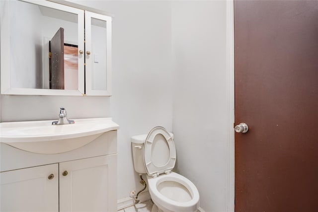 bathroom with toilet and vanity