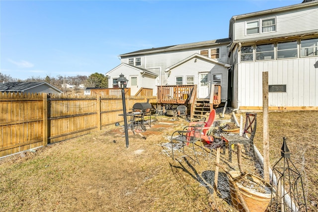 back of house featuring a wooden deck