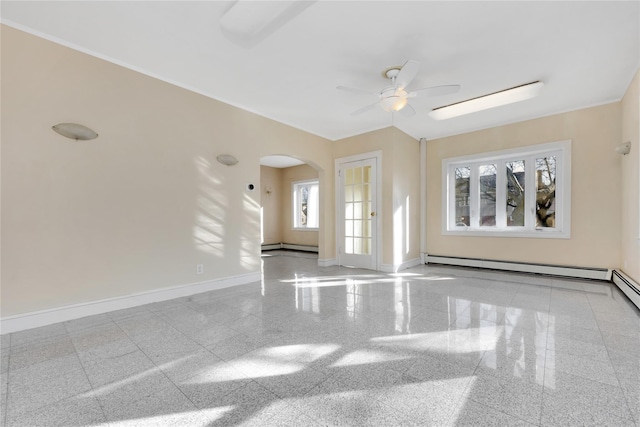 unfurnished room with ceiling fan and a baseboard heating unit