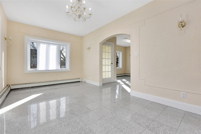 empty room featuring a notable chandelier and a baseboard radiator