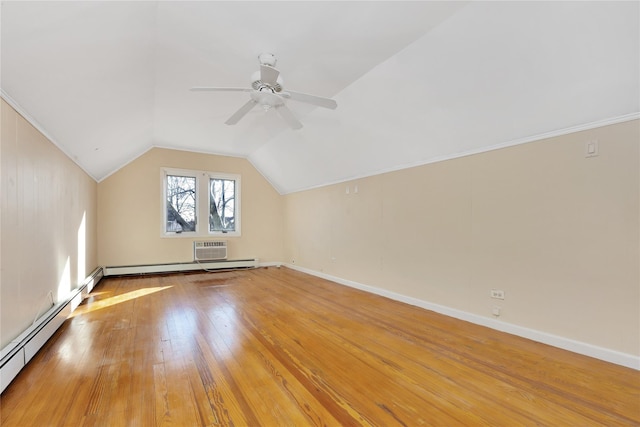 bonus room with ceiling fan, hardwood / wood-style floors, a baseboard heating unit, and vaulted ceiling