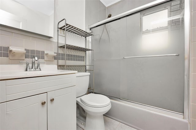 full bathroom featuring enclosed tub / shower combo, vanity, backsplash, tile walls, and toilet