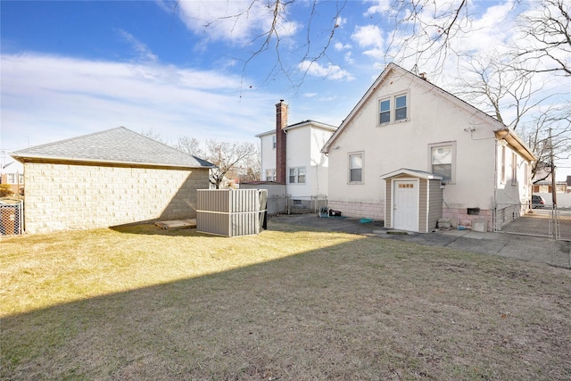 back of house with a yard