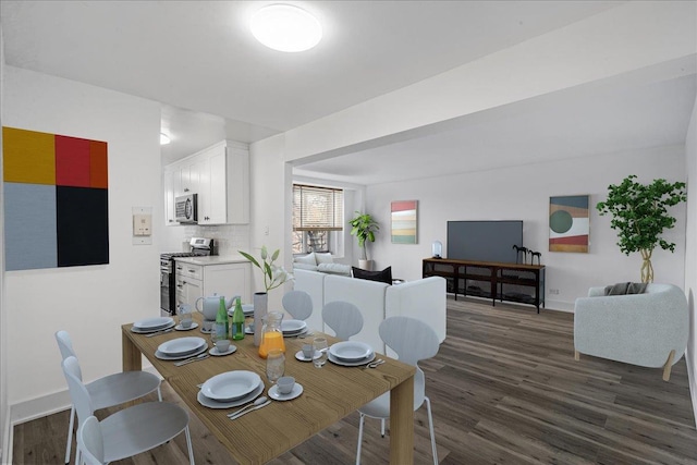 dining area with dark hardwood / wood-style flooring