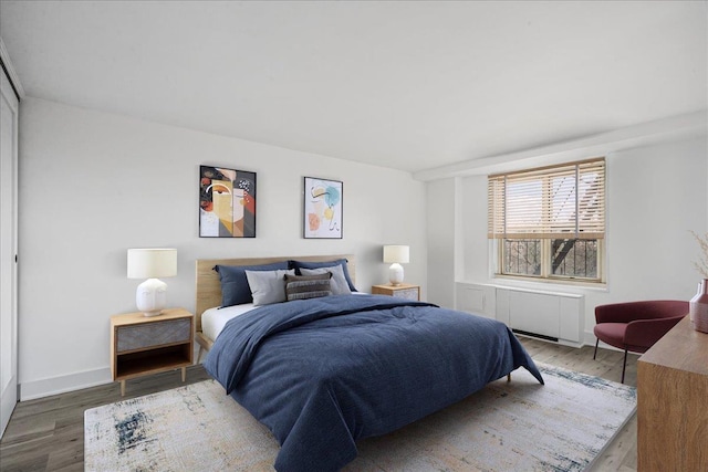 bedroom with hardwood / wood-style flooring