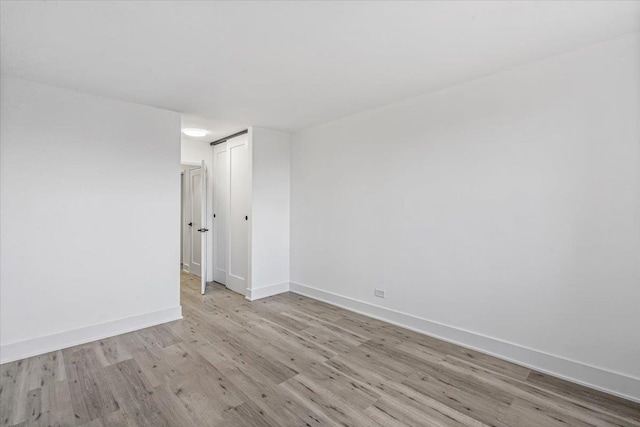 unfurnished room featuring light hardwood / wood-style flooring