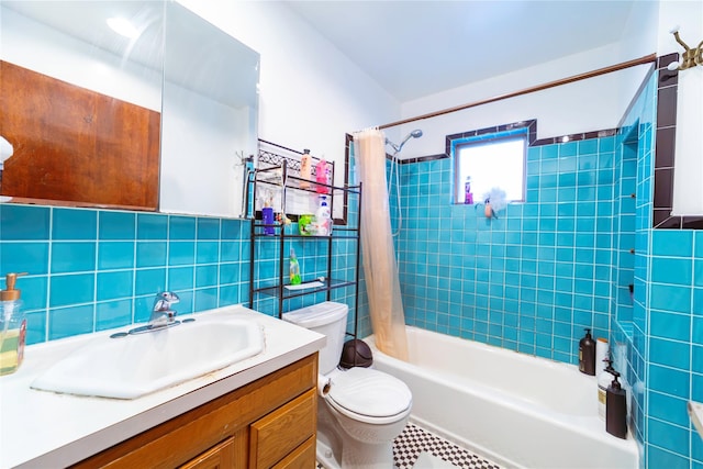 full bathroom with tile walls, backsplash, vanity, toilet, and shower / bath combo with shower curtain