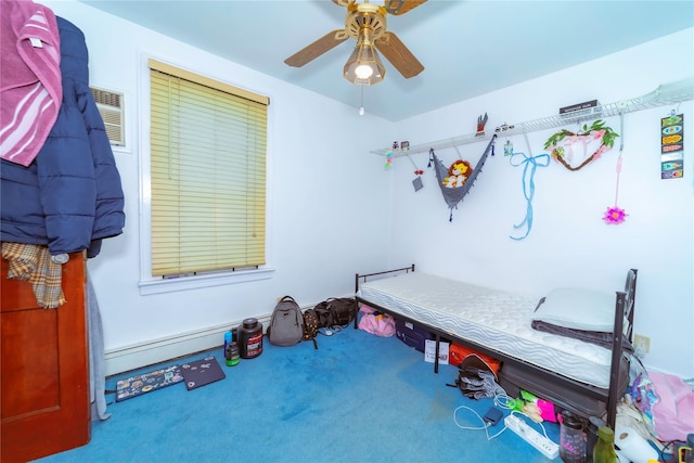 bedroom with a baseboard radiator, ceiling fan, and carpet