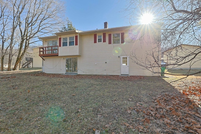 rear view of house with a lawn