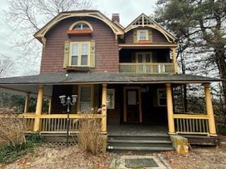 view of front of home with covered porch and a balcony