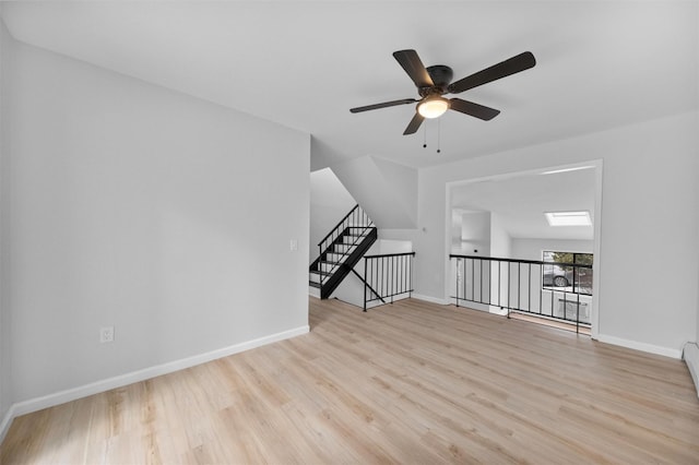 interior space featuring light hardwood / wood-style floors and ceiling fan