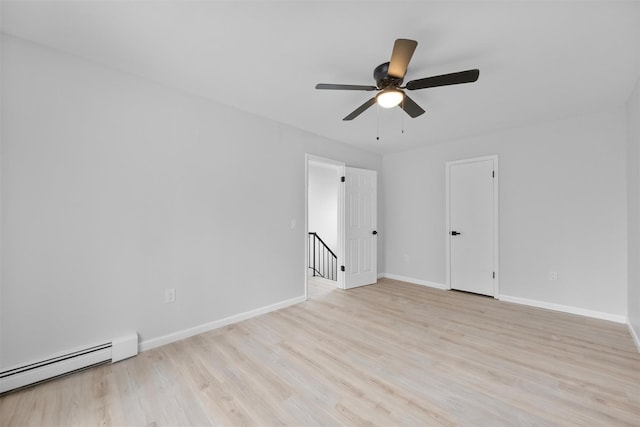 unfurnished room with ceiling fan, baseboard heating, and light hardwood / wood-style flooring