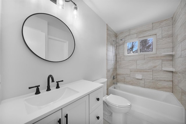 full bathroom featuring vanity, toilet, and tiled shower / bath