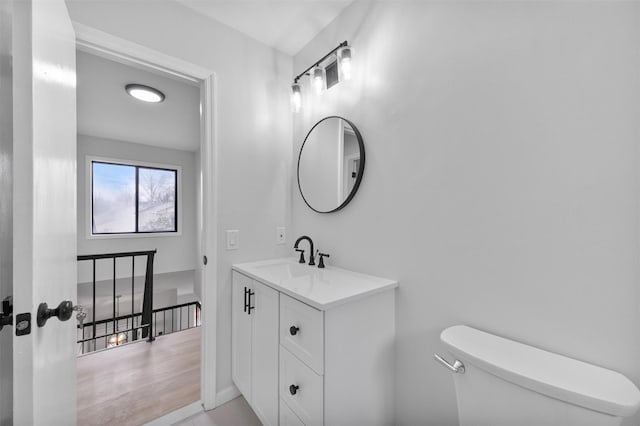 bathroom with tile patterned floors, vanity, and toilet