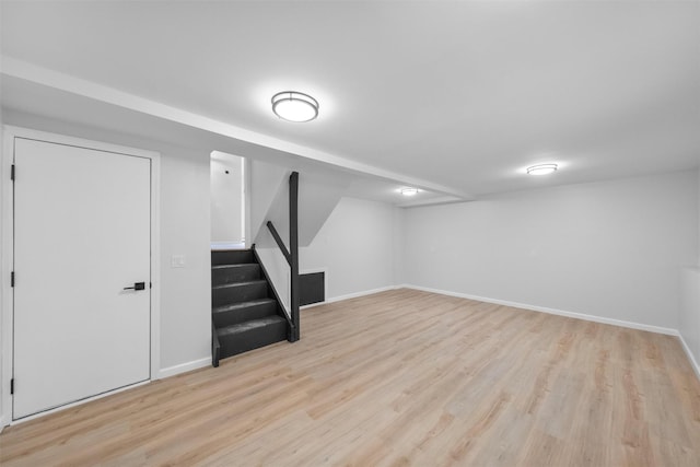 basement featuring light hardwood / wood-style floors