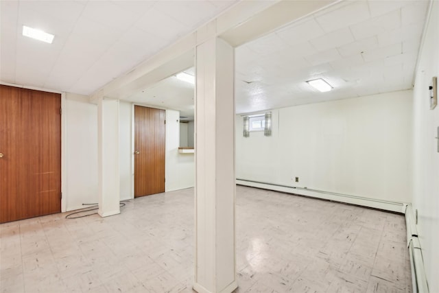 basement featuring a baseboard radiator