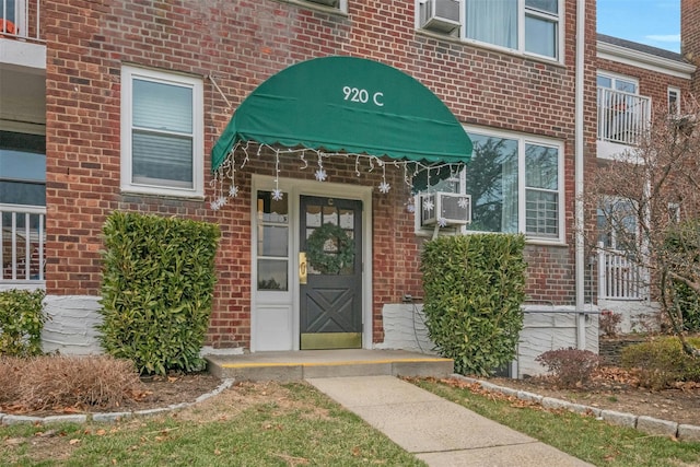 property entrance featuring cooling unit