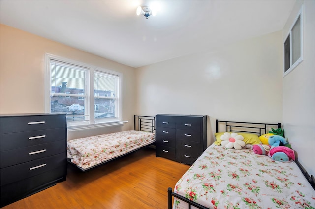 bedroom featuring wood-type flooring