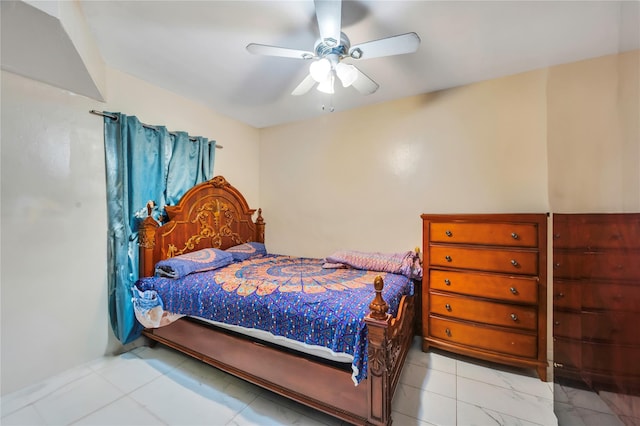 bedroom with ceiling fan and light tile patterned flooring