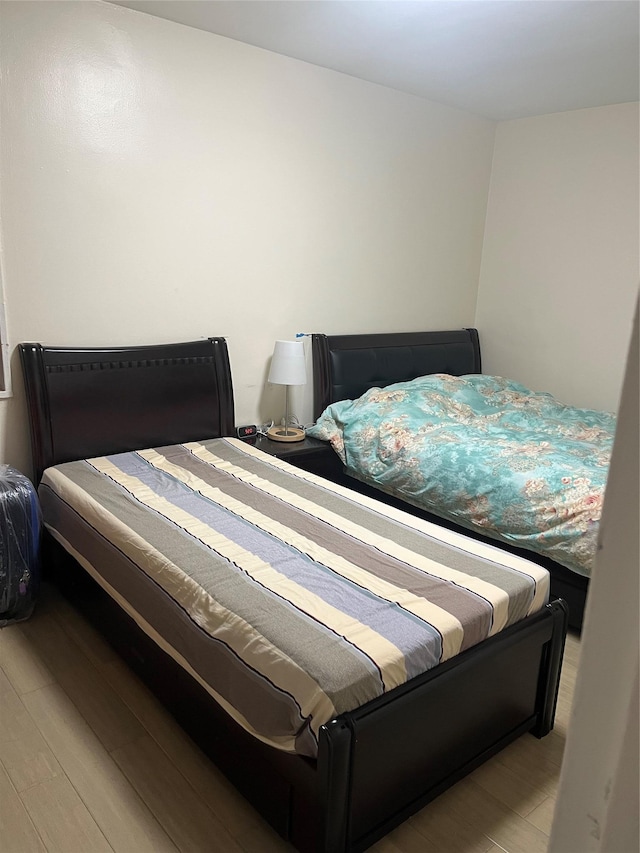 bedroom with light wood-type flooring