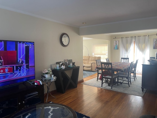 dining area featuring crown molding and wood-type flooring