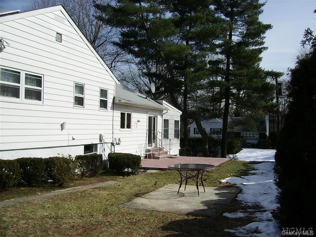 rear view of property featuring a patio