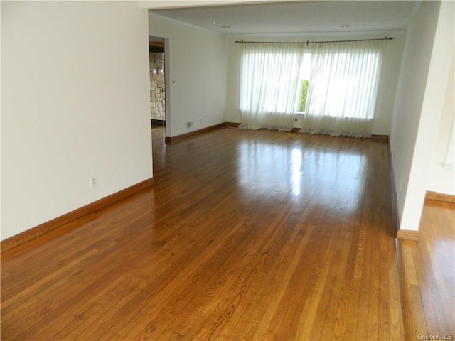 spare room with wood-type flooring