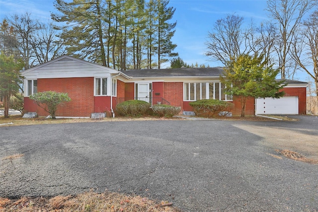 single story home featuring a garage