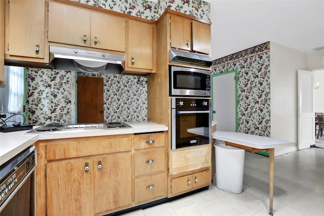 kitchen featuring backsplash and stainless steel appliances