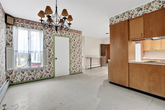 kitchen with baseboard heating, hanging light fixtures, and an inviting chandelier