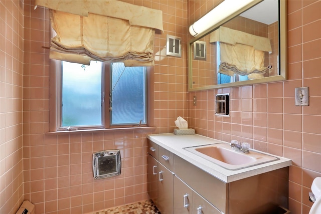 bathroom with vanity and tile walls