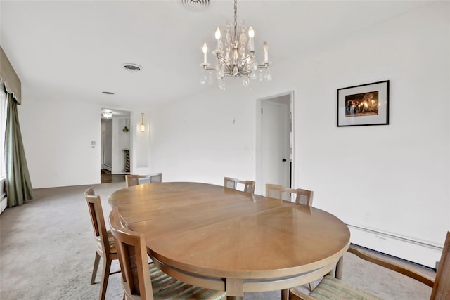 dining space featuring carpet floors, a baseboard radiator, and a notable chandelier