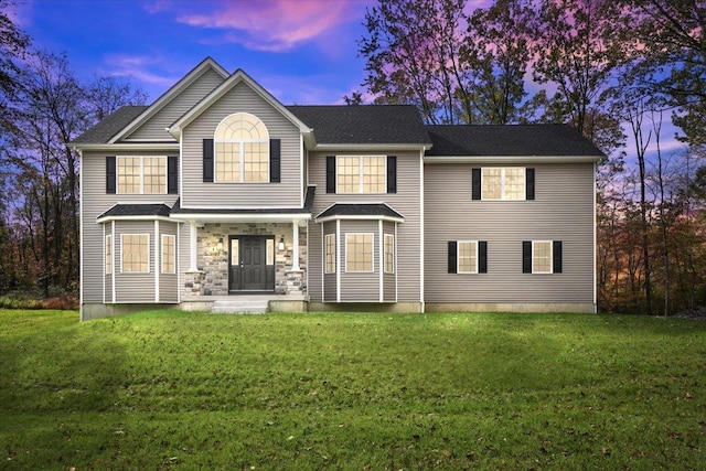 view of front of property with a lawn