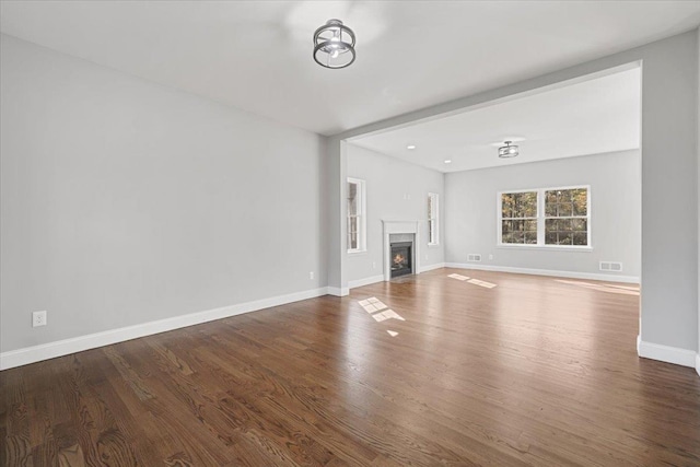 unfurnished living room with hardwood / wood-style floors