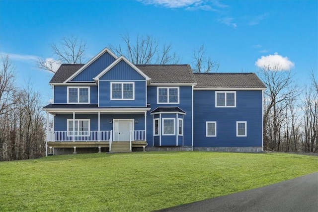 view of front of home with a porch and a front yard