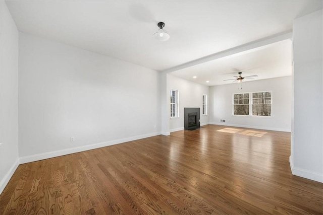 unfurnished living room with hardwood / wood-style floors and ceiling fan