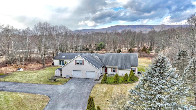 birds eye view of property featuring a mountain view