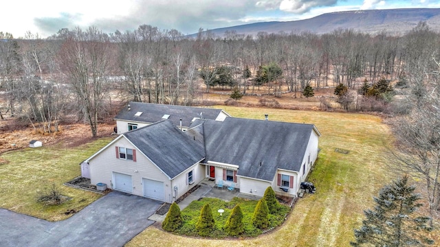 birds eye view of property featuring a mountain view