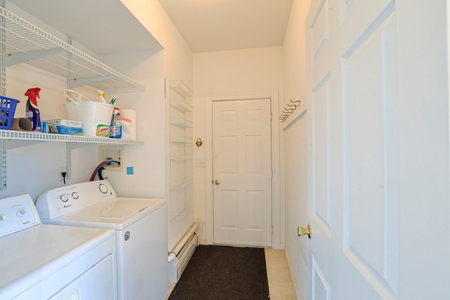 clothes washing area with separate washer and dryer and a baseboard heating unit