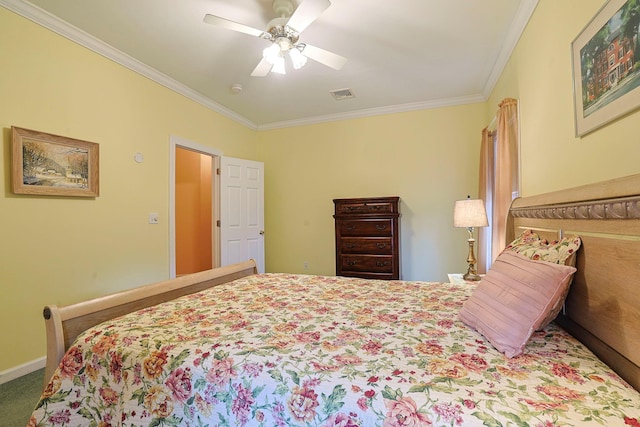 bedroom with carpet, ceiling fan, and ornamental molding