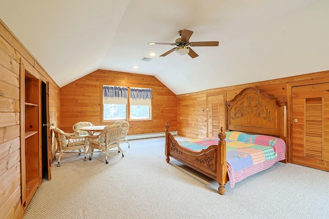 carpeted bedroom featuring a baseboard radiator, vaulted ceiling, ceiling fan, and wood walls