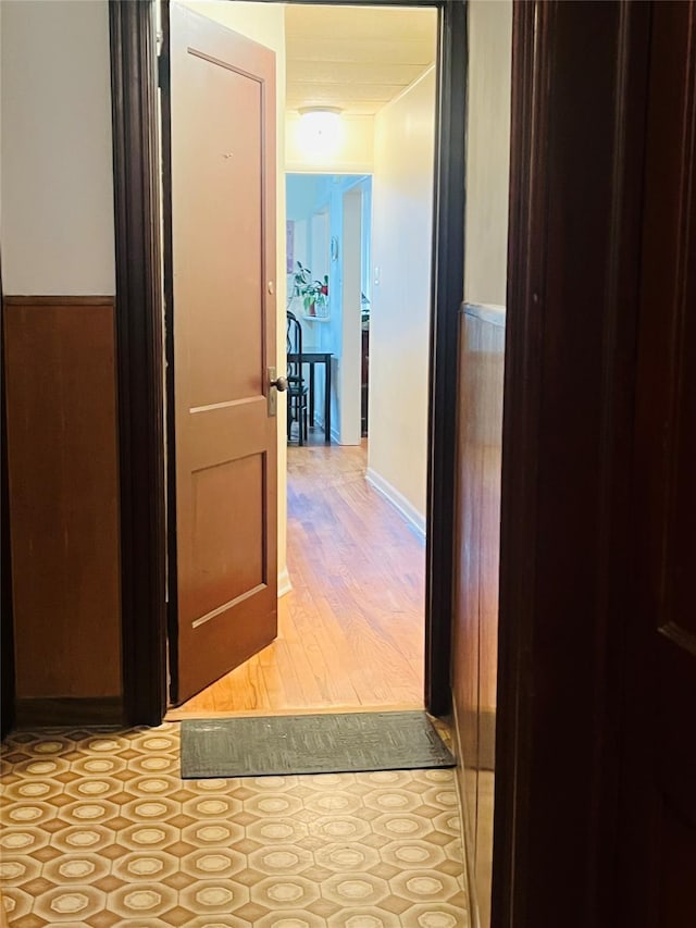 corridor with light wood-type flooring