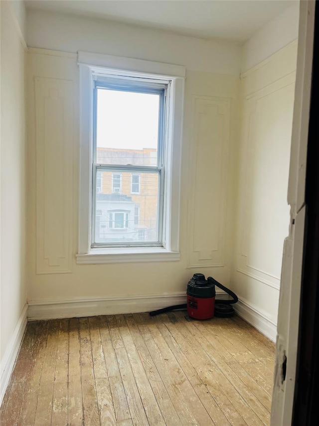 spare room featuring hardwood / wood-style floors