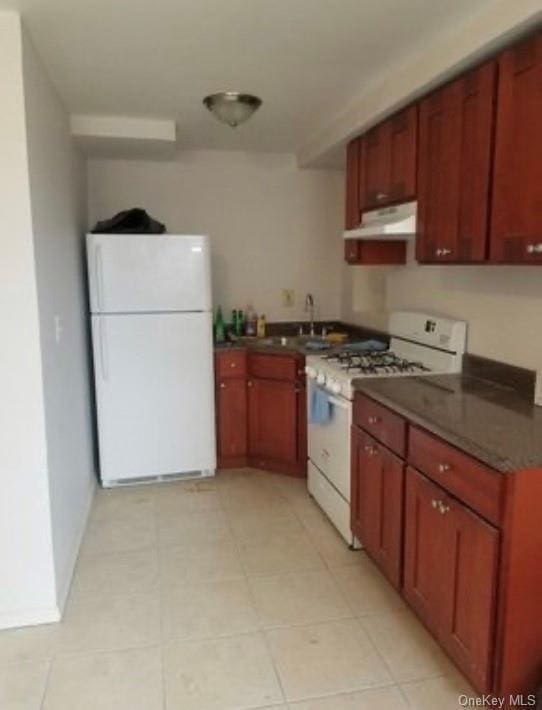 kitchen featuring sink and white appliances