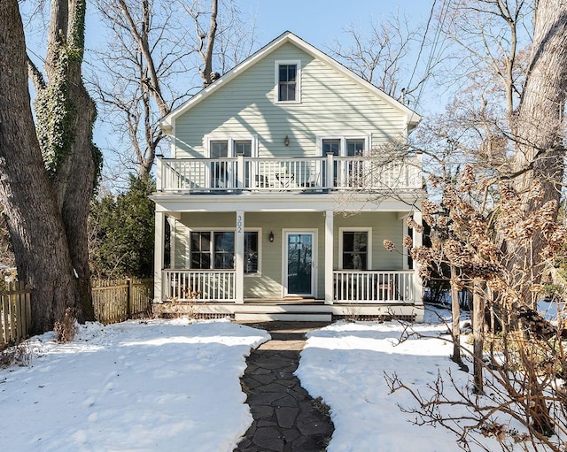 view of front facade featuring a balcony and covered porch