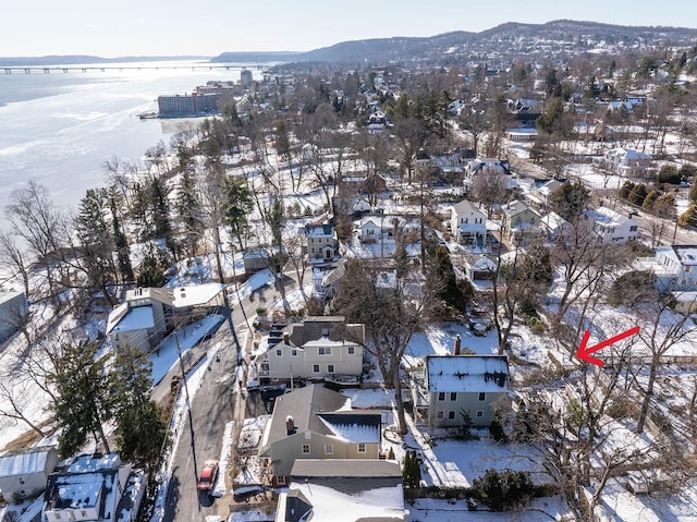 snowy aerial view with a mountain view